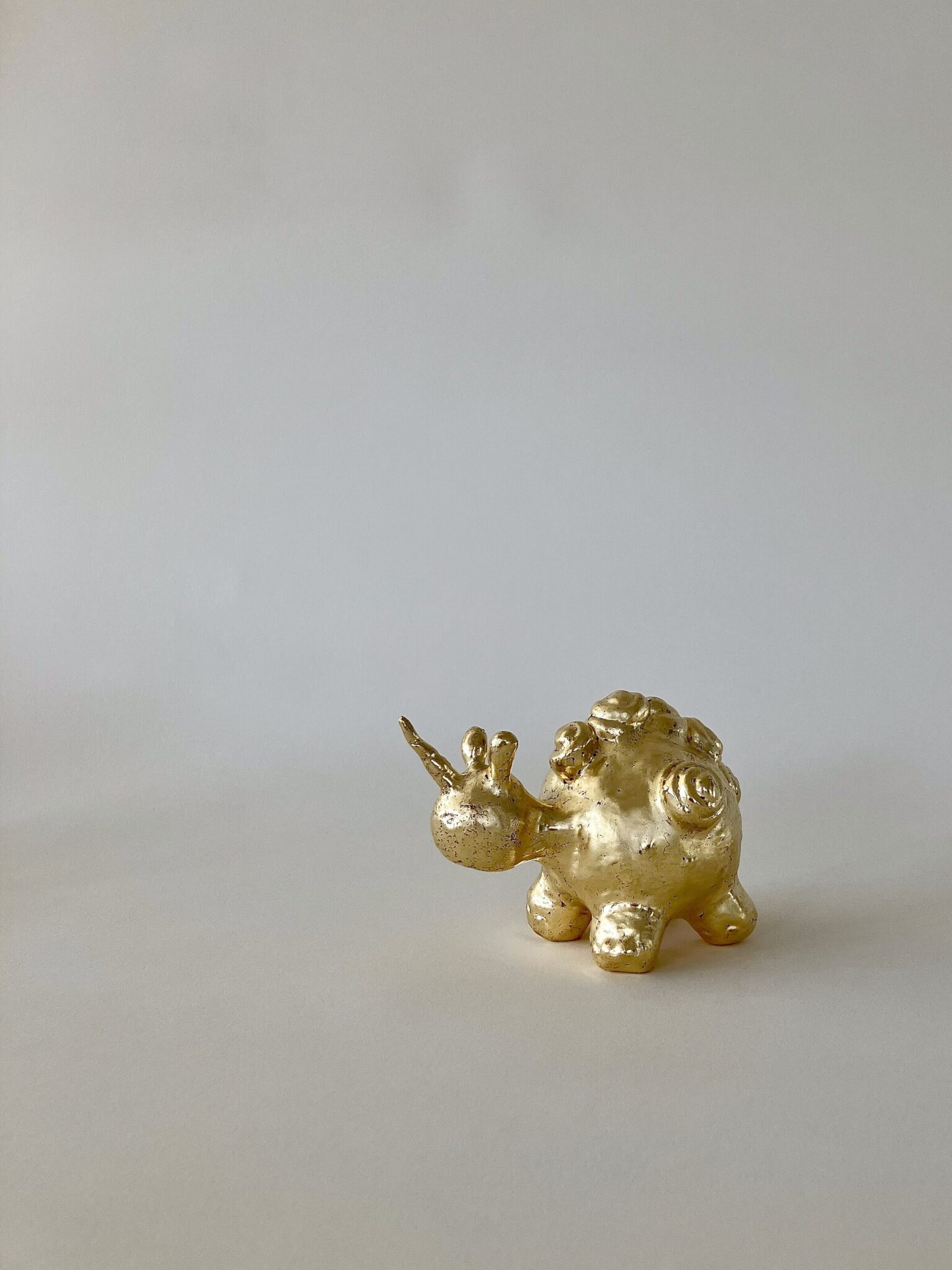 Tina Scepanovic, Unicorn, 24K gold over paper clay and aluminum, 3 x 3 x 4 inches