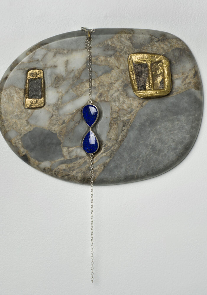 One Stone Looking Out the Window by Lara Saget
